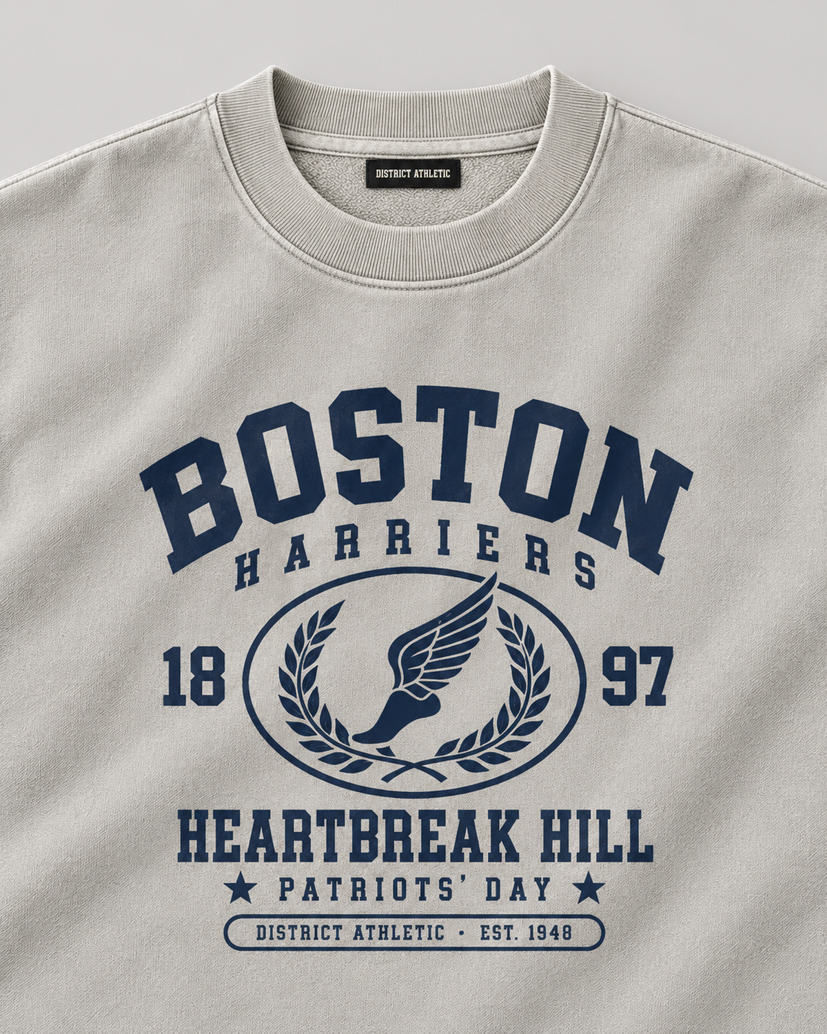 The Boston Harriers Crewneck in washed grey, chest print detail