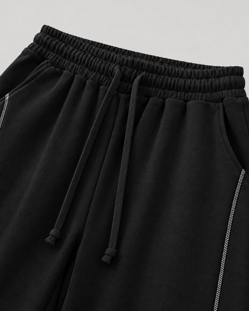 The Barrel Sweatpant in black, waist and pocket detail