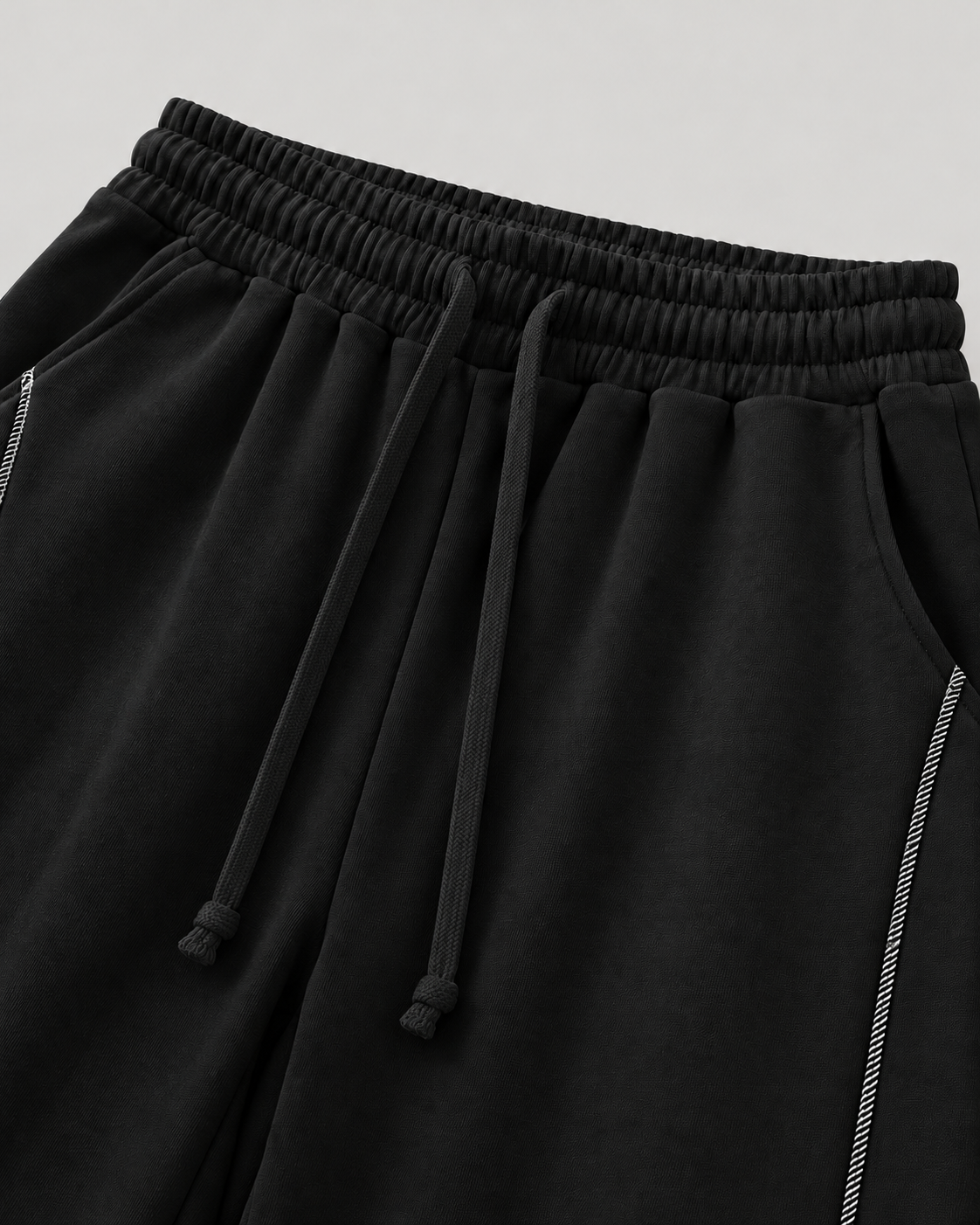 The Barrel Sweatpant in black, waist and pocket detail