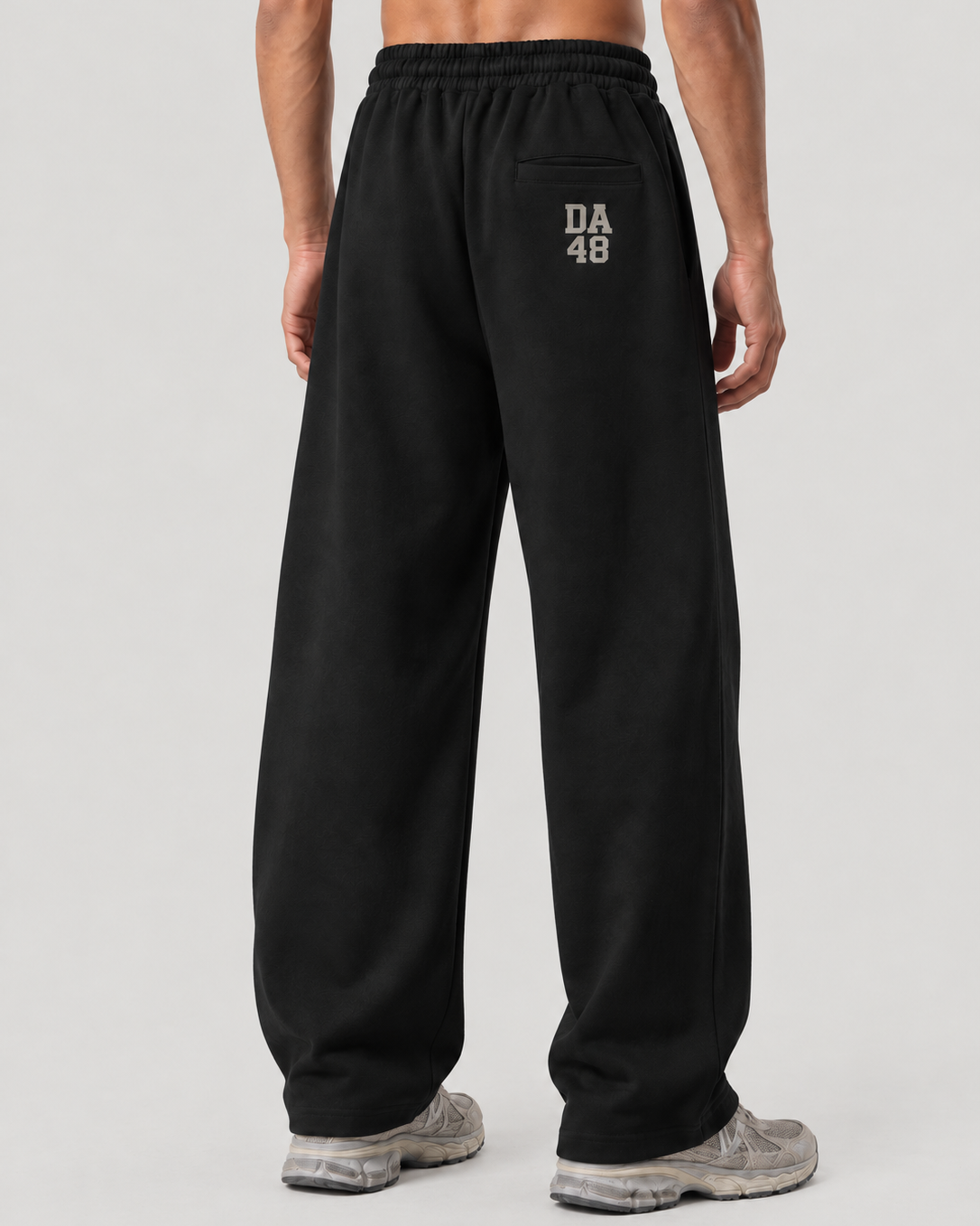 The Barrel Sweatpant in black, on model, back