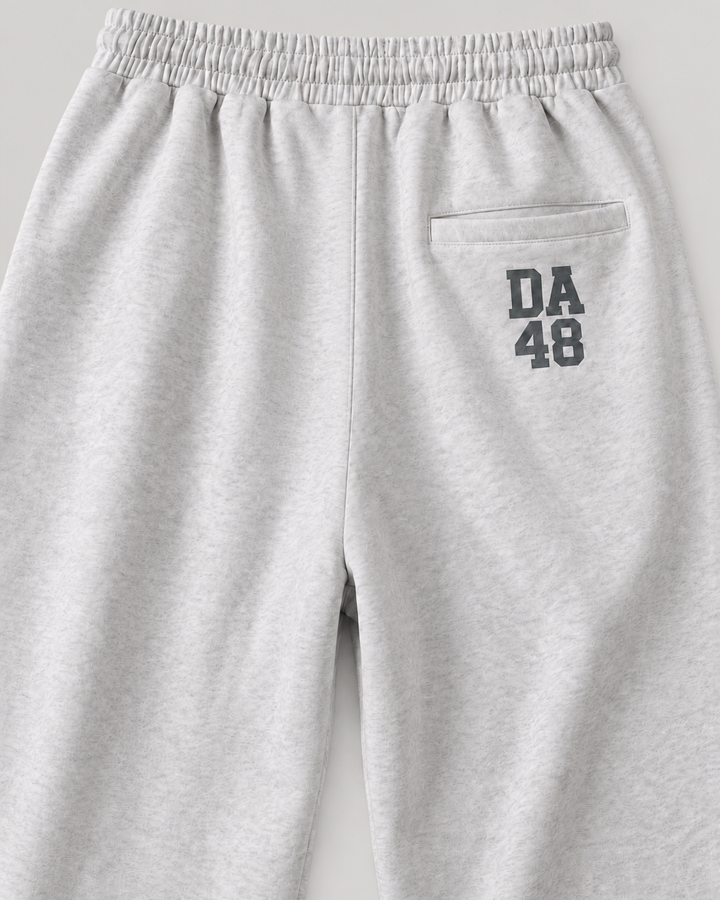 The Barrel Sweatpant in grey marl, back print detail