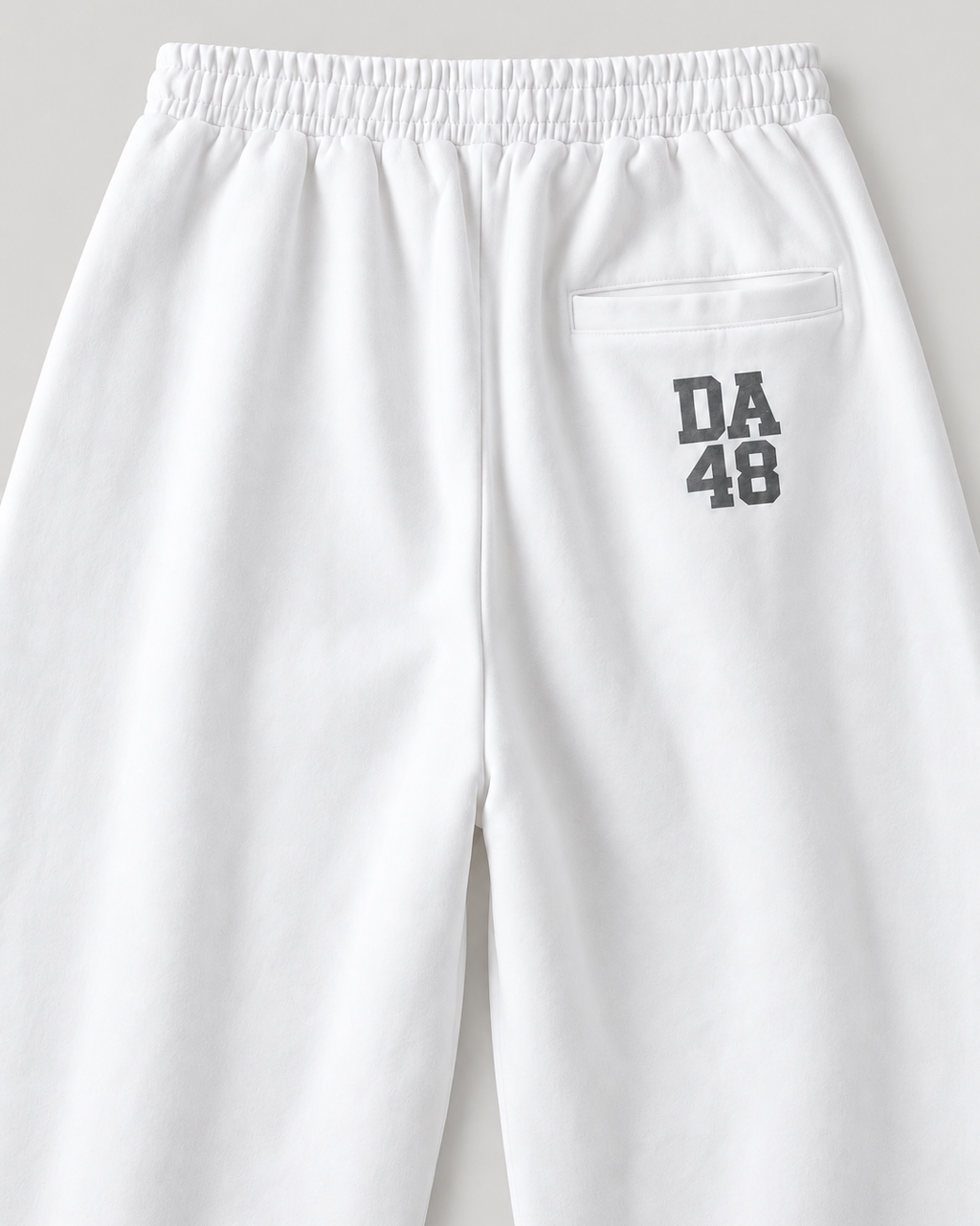 The Barrel Sweatpant in white, back print detail