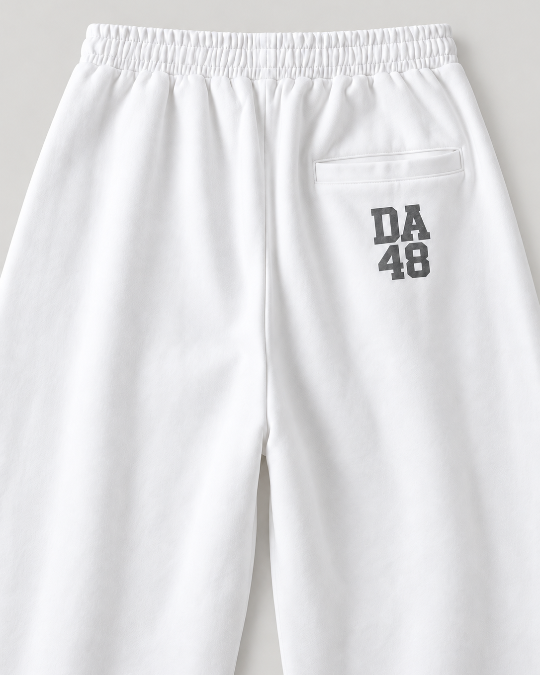 The Barrel Sweatpant in white, back print detail