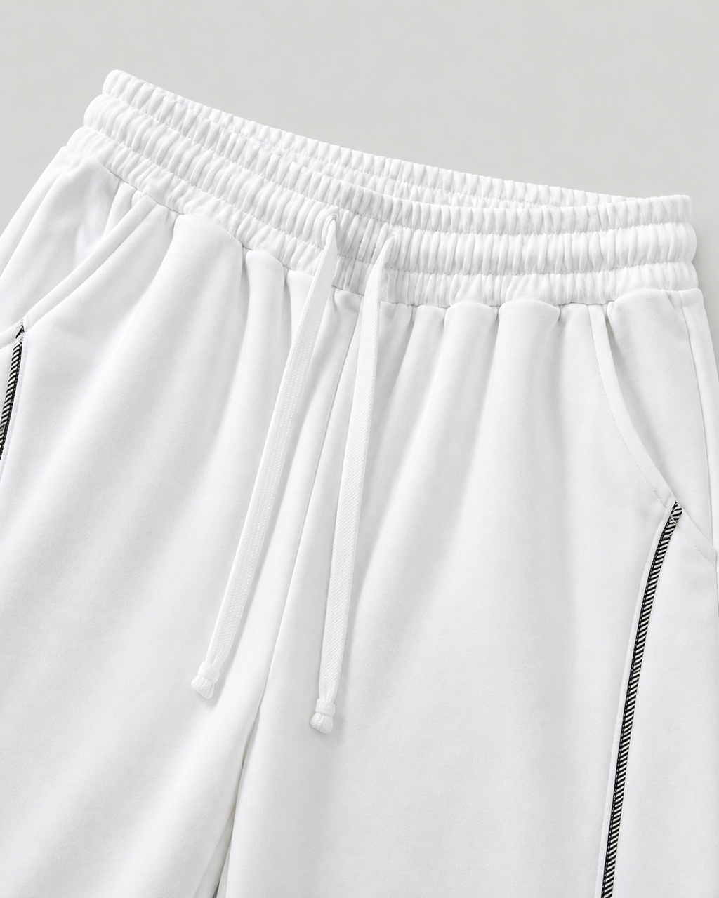 The Barrel Sweatpant in white, waist and pocket detail