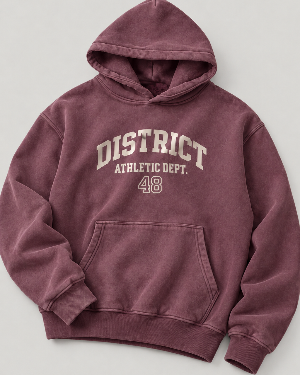 The District Hoodie in burgundy, chest print detail