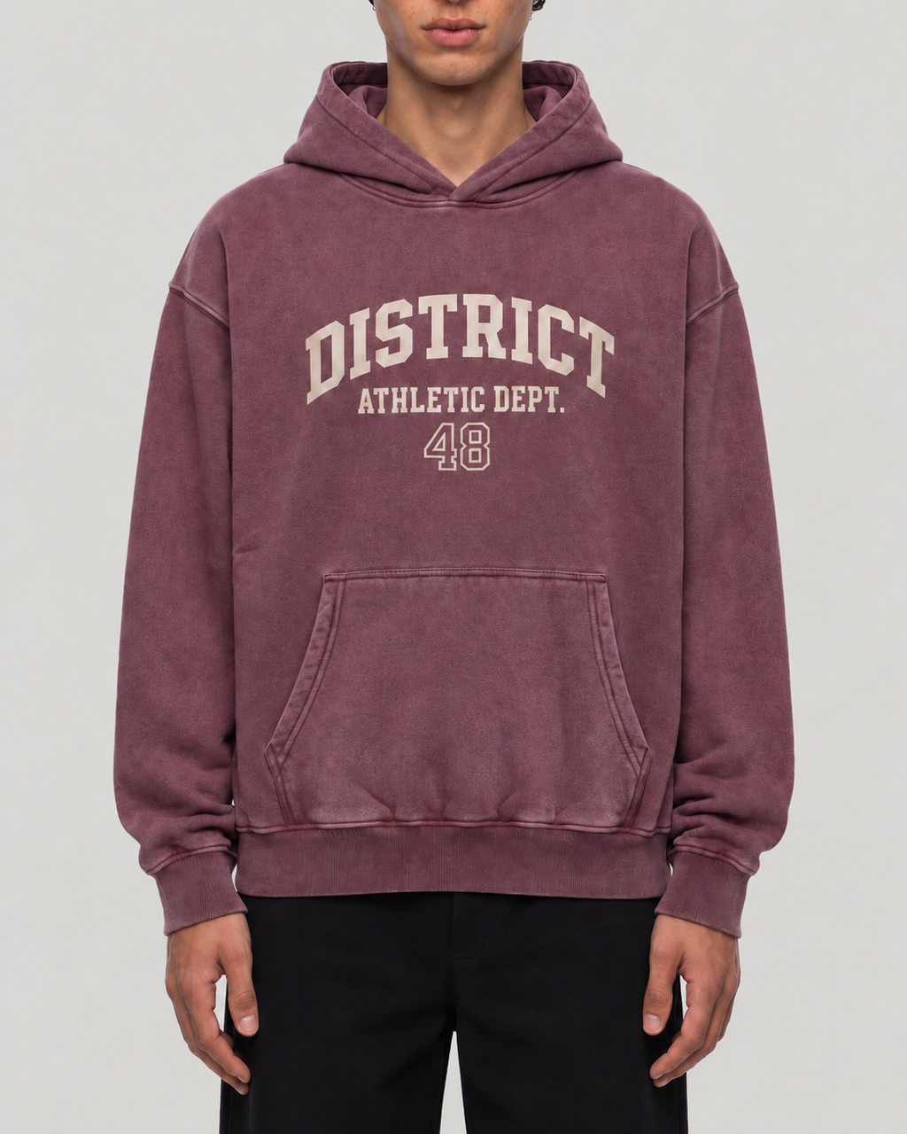 The District Hoodie in burgundy, on model, front