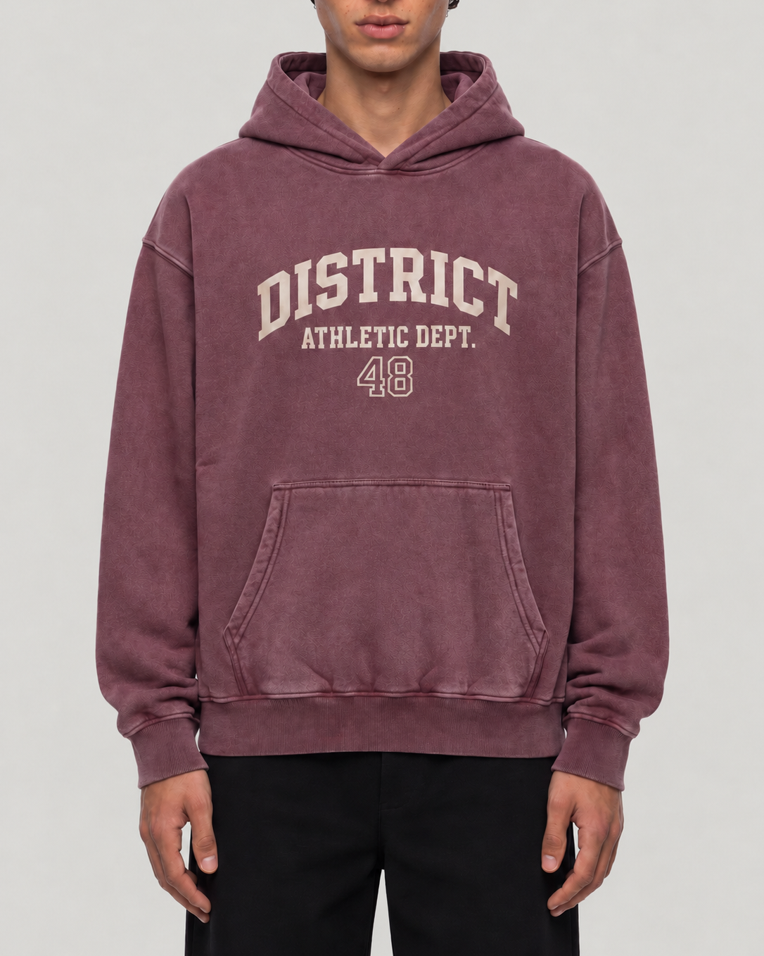 The District Hoodie in burgundy, on model, front