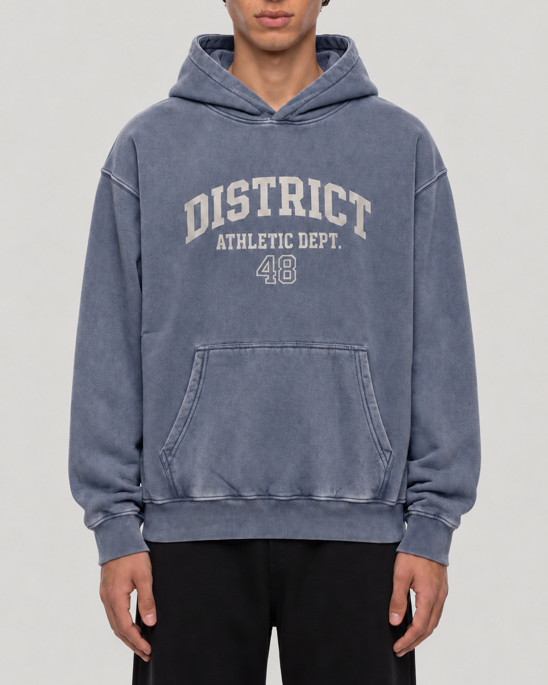 The District Hoodie in slate blue, on model, front