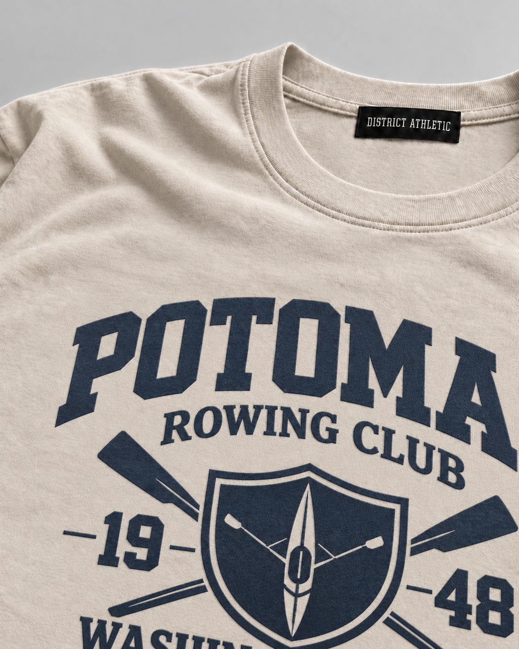The Potomac Tee in sand with navy print, print detail