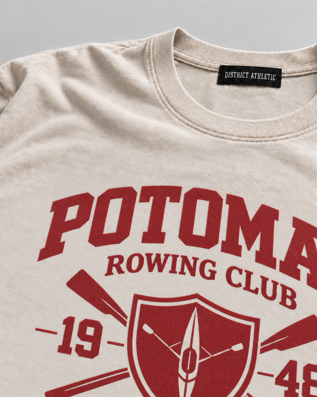 The Potomac Tee in sand with red print, print detail
